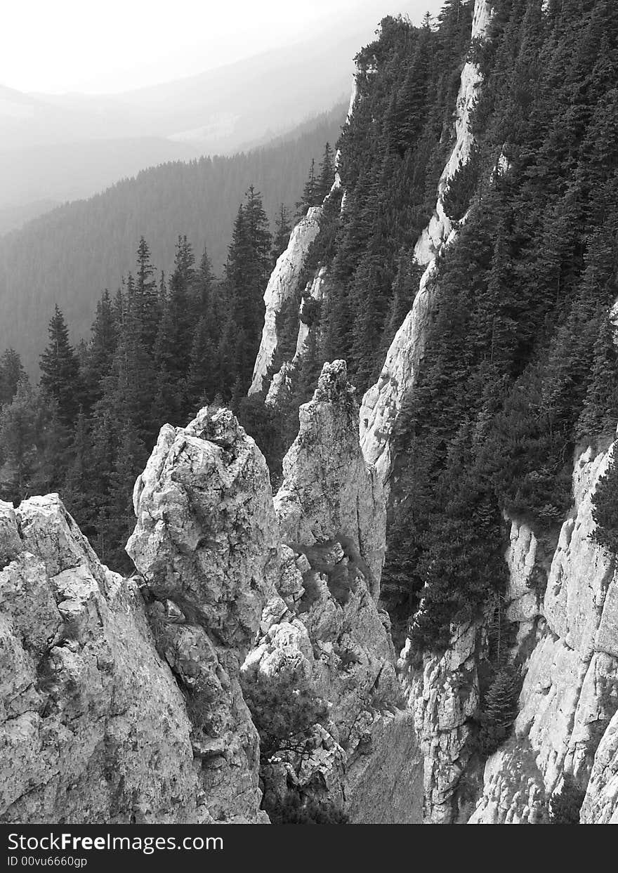 Mountains in Romania from unusual viewpoint. Black and white coloring draws all attention to the great altitude. Mountains in Romania from unusual viewpoint. Black and white coloring draws all attention to the great altitude