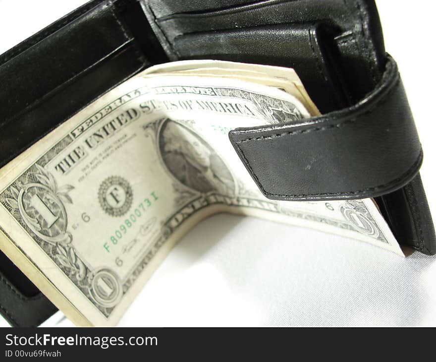 Black leather purse pouch with paper money dollars isolated on white. Black leather purse pouch with paper money dollars isolated on white