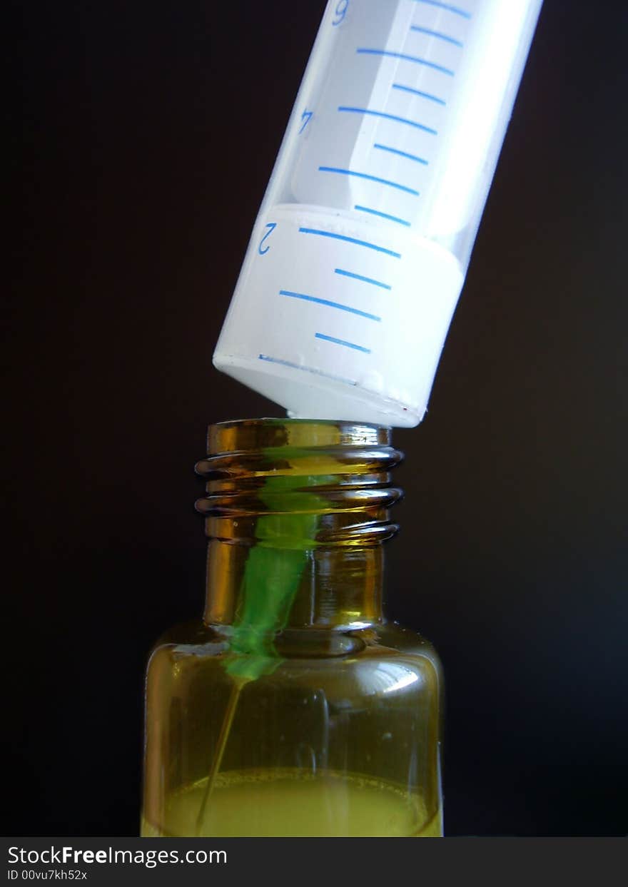 Syringe with small bottle - detail from laboratory.