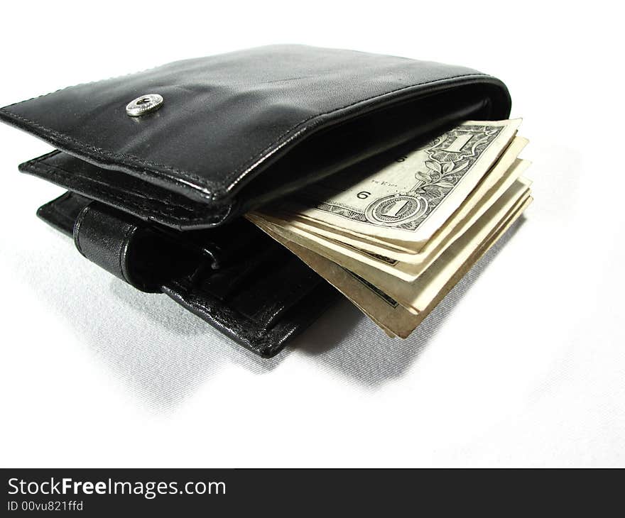 Black leather purse pouch with paper money dollars isolated on white. Black leather purse pouch with paper money dollars isolated on white