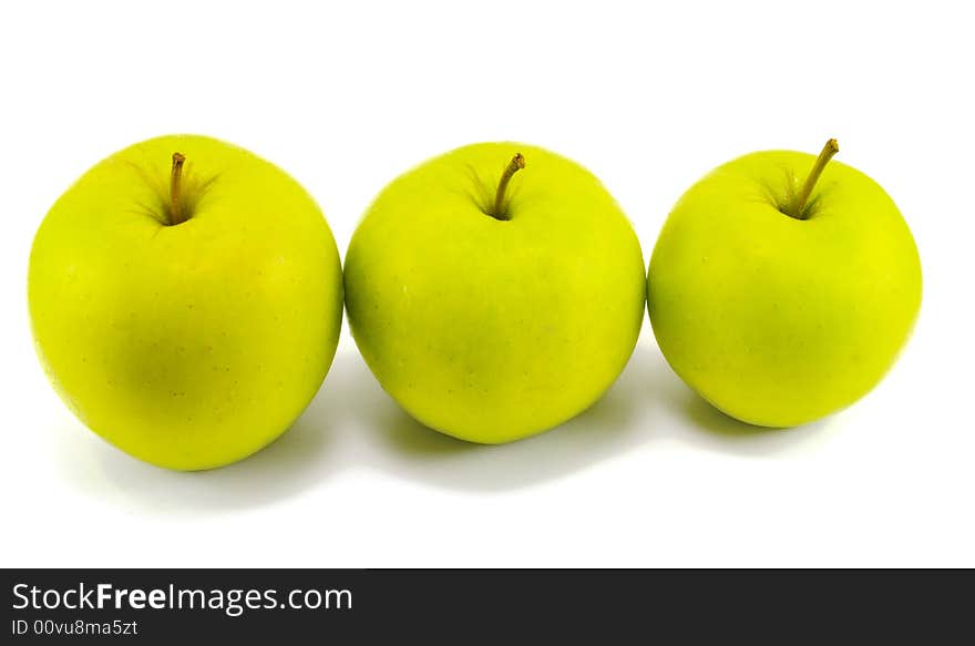 Three fresh apples on white