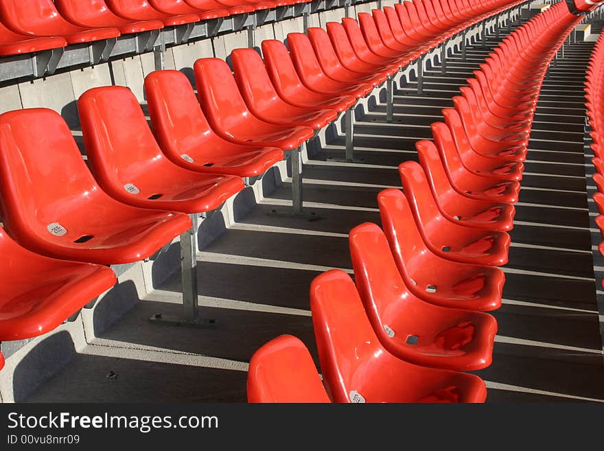 Red seats in a empty stadium. Red seats in a empty stadium