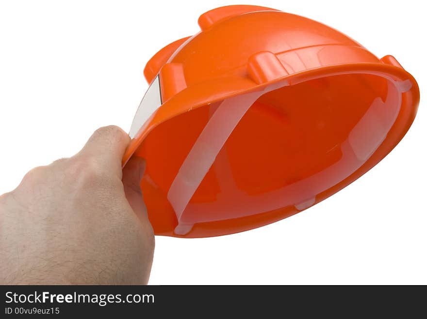 Construction helmet in the man's hand, isolated on the white background