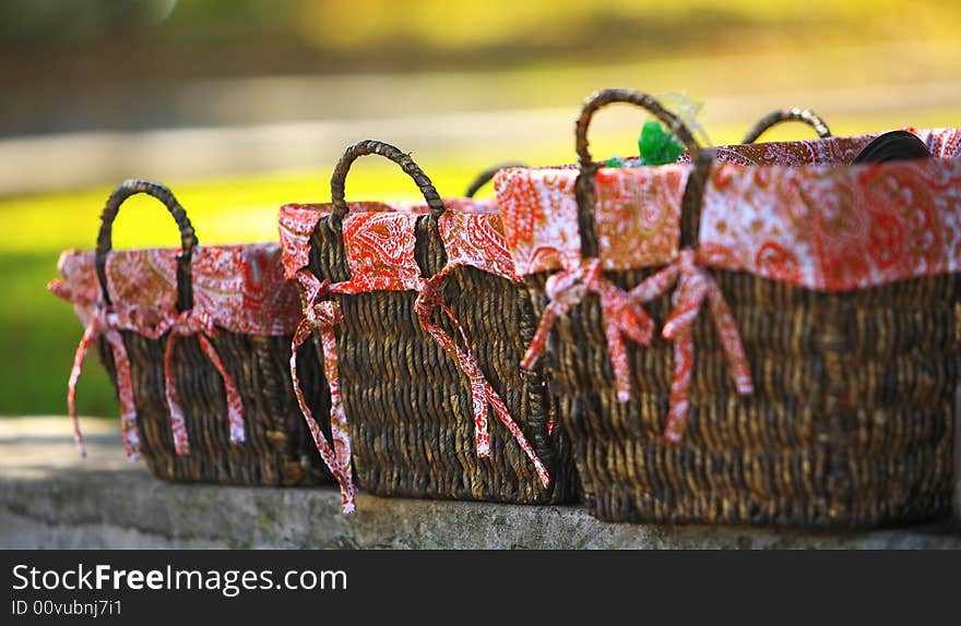 A close up shot of Three straw picnic baskets