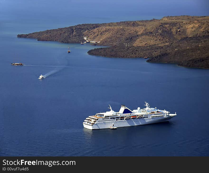 Touristic cruiseship near Santorini in Greece. Touristic cruiseship near Santorini in Greece