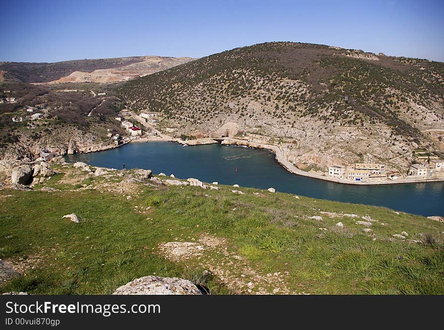 Mountains and a blue gulf at early spring