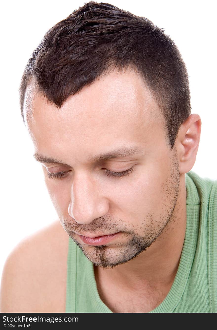 Melancholy man looking down, isolated on white background