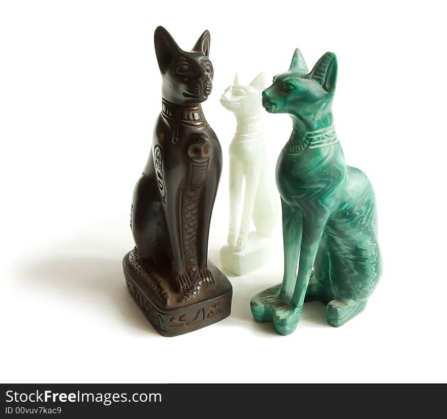 Stone Egyptian cats on a white background