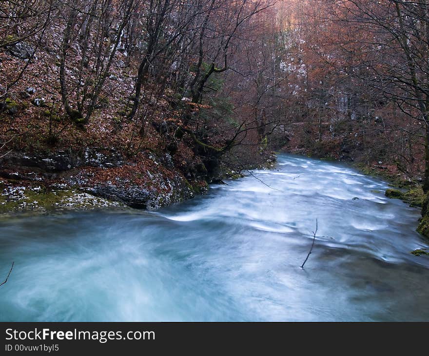 River flowing through small canyon in late fall