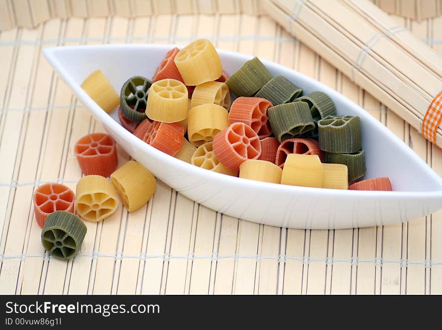 Beautiful table-ware with pasta tricolore