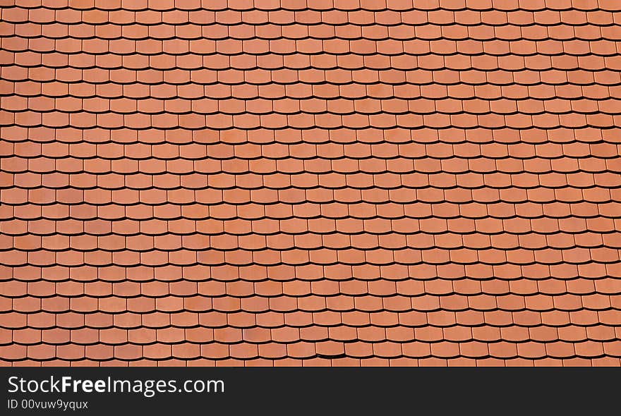 Traditional orange tiles of a newly built house. Traditional orange tiles of a newly built house