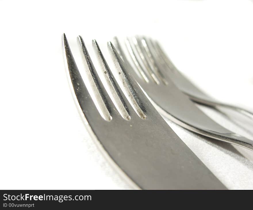 Metal silver forks isolated on white closeup. Metal silver forks isolated on white closeup