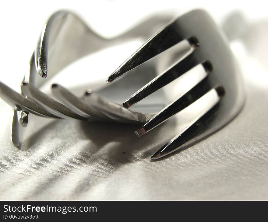 Three metal silver forks isolated closeup