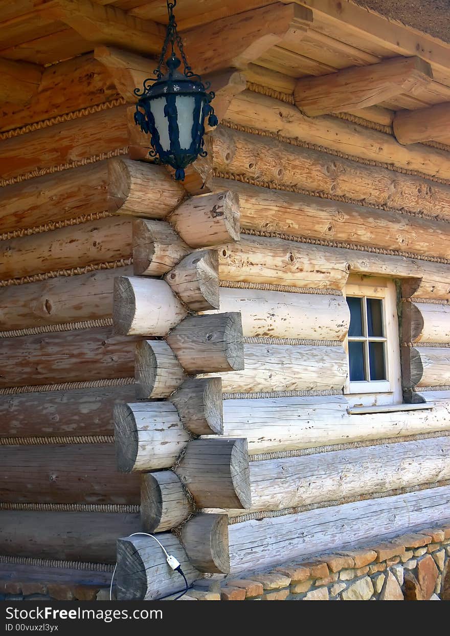 The old wooden house detail. Junction made without nails and hanging lamp.