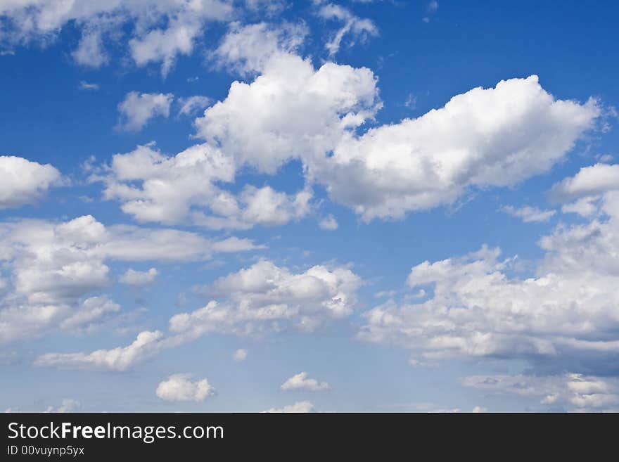 Fluffy clouds on blue sky