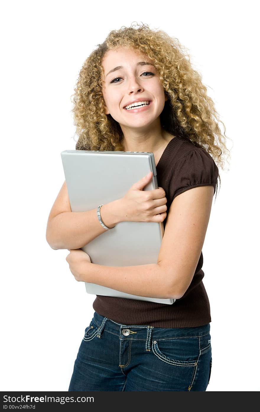 A beautiful young women hugging her portable computer for dear life. A beautiful young women hugging her portable computer for dear life