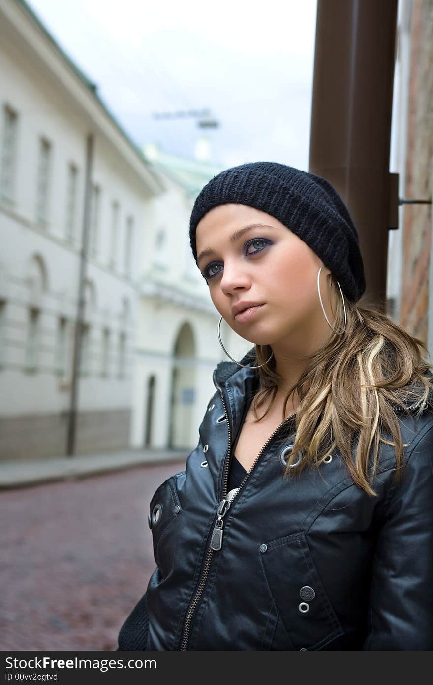 Portrait Of The Girl Near Wall