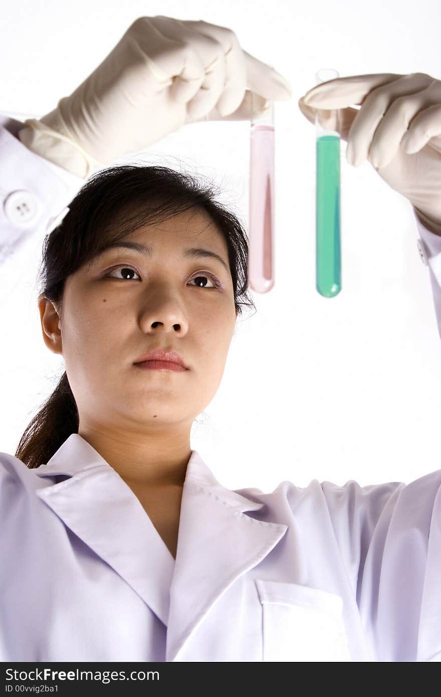 Female scientist with test tube in white background.