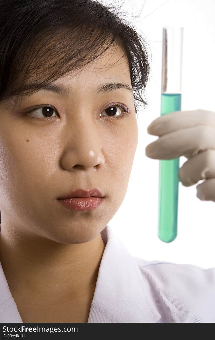 Female scientist with test tube in white background.