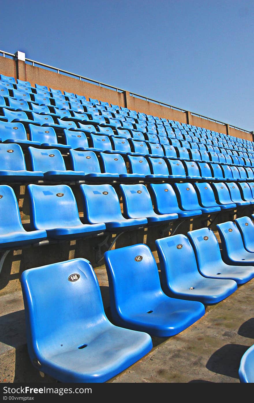 This is can hold over ten thousand person of stadiums. Green lawn and blue sky. This is can hold over ten thousand person of stadiums. Green lawn and blue sky.