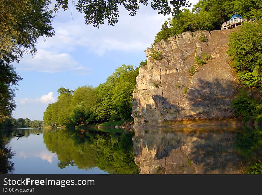 Rock reflected in the river