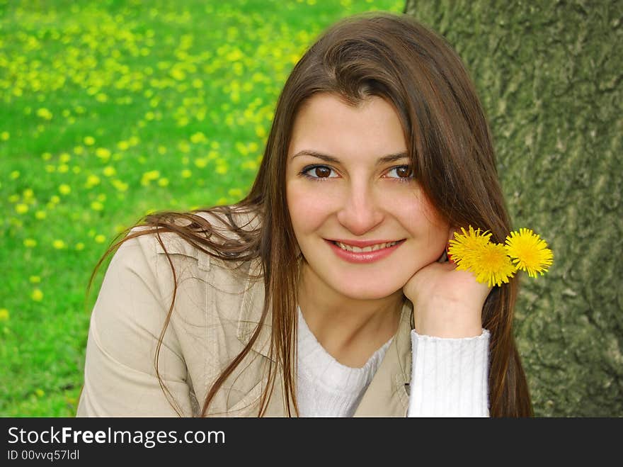 Smiling girl with yellow flowers