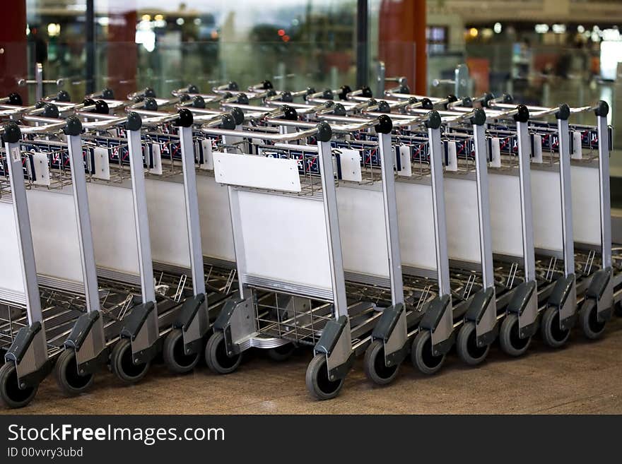 Set of empty baggage cars at airport terminal