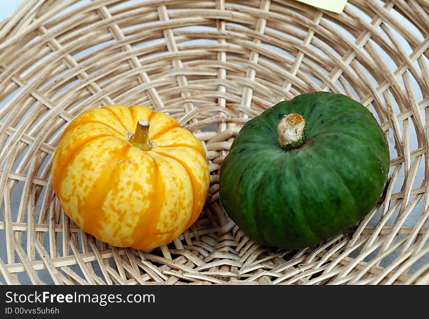 Fresh little pumpkins in basket. Fresh little pumpkins in basket