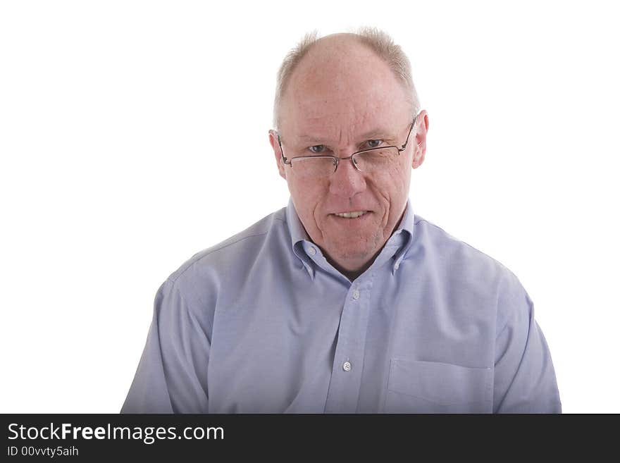 An older guy in a blue dress shirt and reading glasses. An older guy in a blue dress shirt and reading glasses