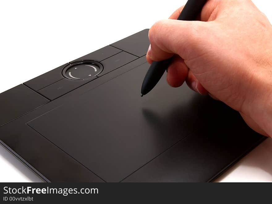 Hand Holding Stylus On Graphics Tablet