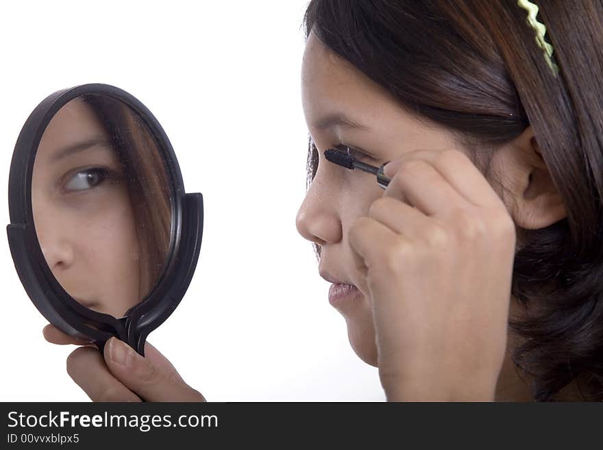 Teenagers applying makeup