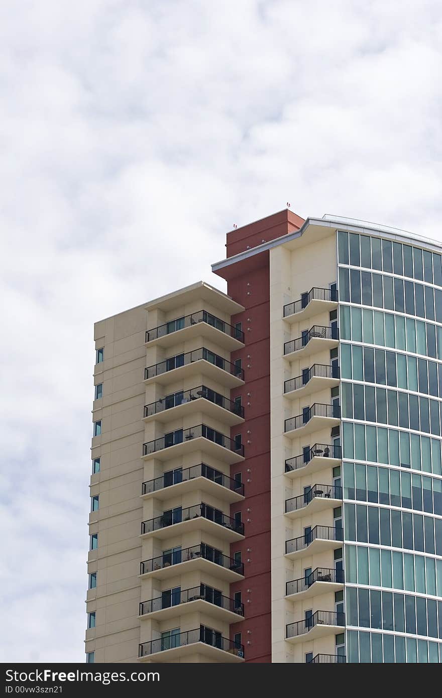 Red White and Blue Condos Against Clouds