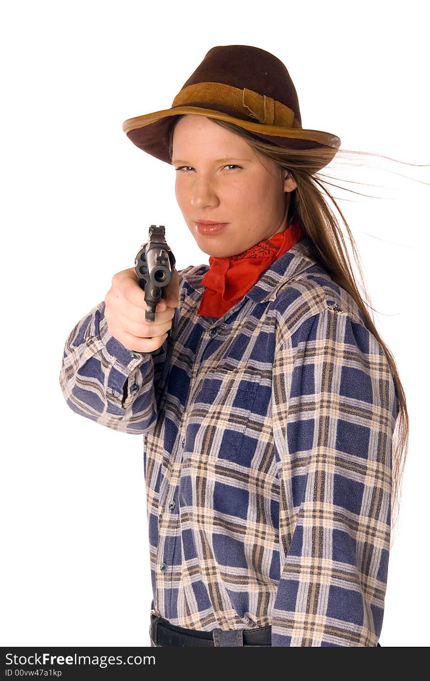 Smiling cowgirl with gun aim at someone (isolated on white)