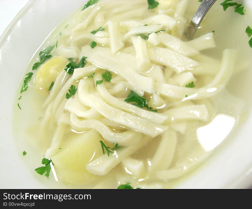 Hot chicken soup bouillon in white dish. Hot chicken soup bouillon in white dish