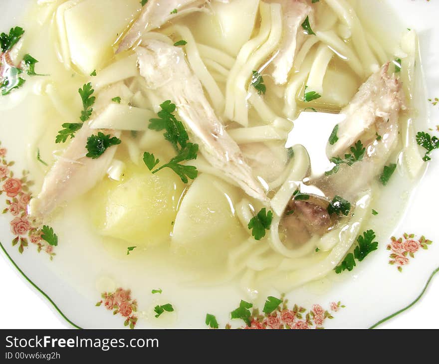 Hot chicken bouillon soup from top