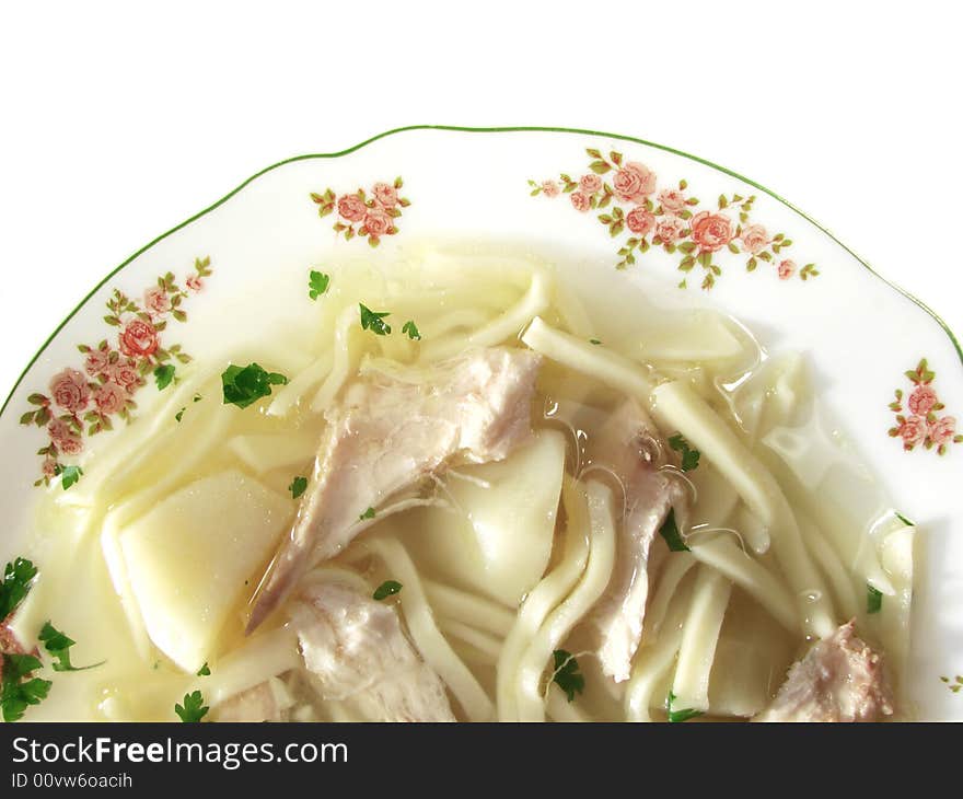 Hot chicken soup bouillon in white dish