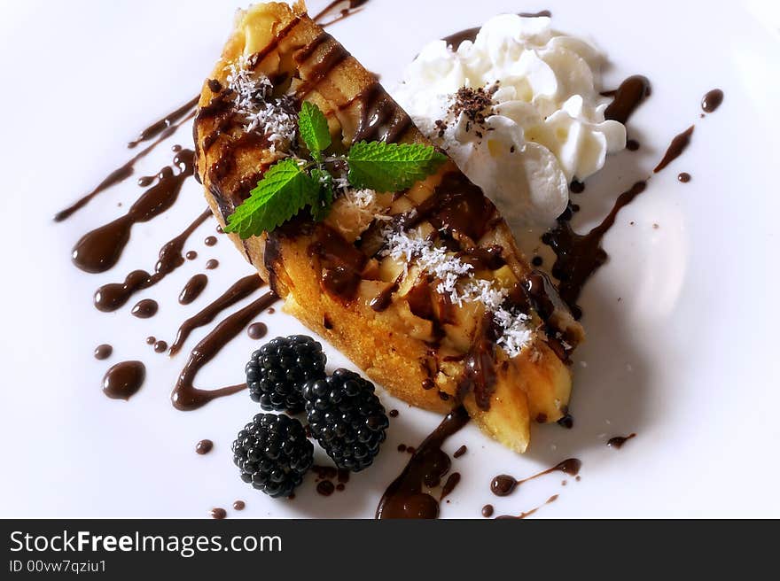 Pie with cream, berries and chocolate sauce. Pie with cream, berries and chocolate sauce