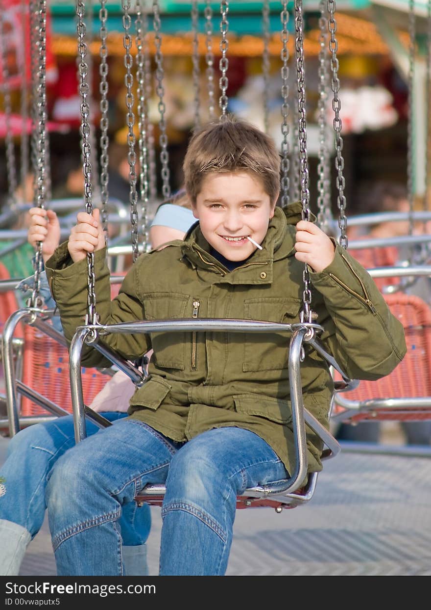 Happy boy on carousel