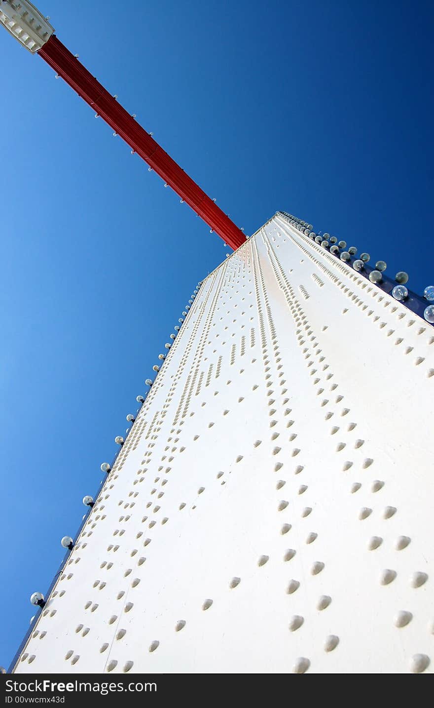 Bold white & red colours of Chelsea Bridge structure against a deep blue sky. Bold white & red colours of Chelsea Bridge structure against a deep blue sky.