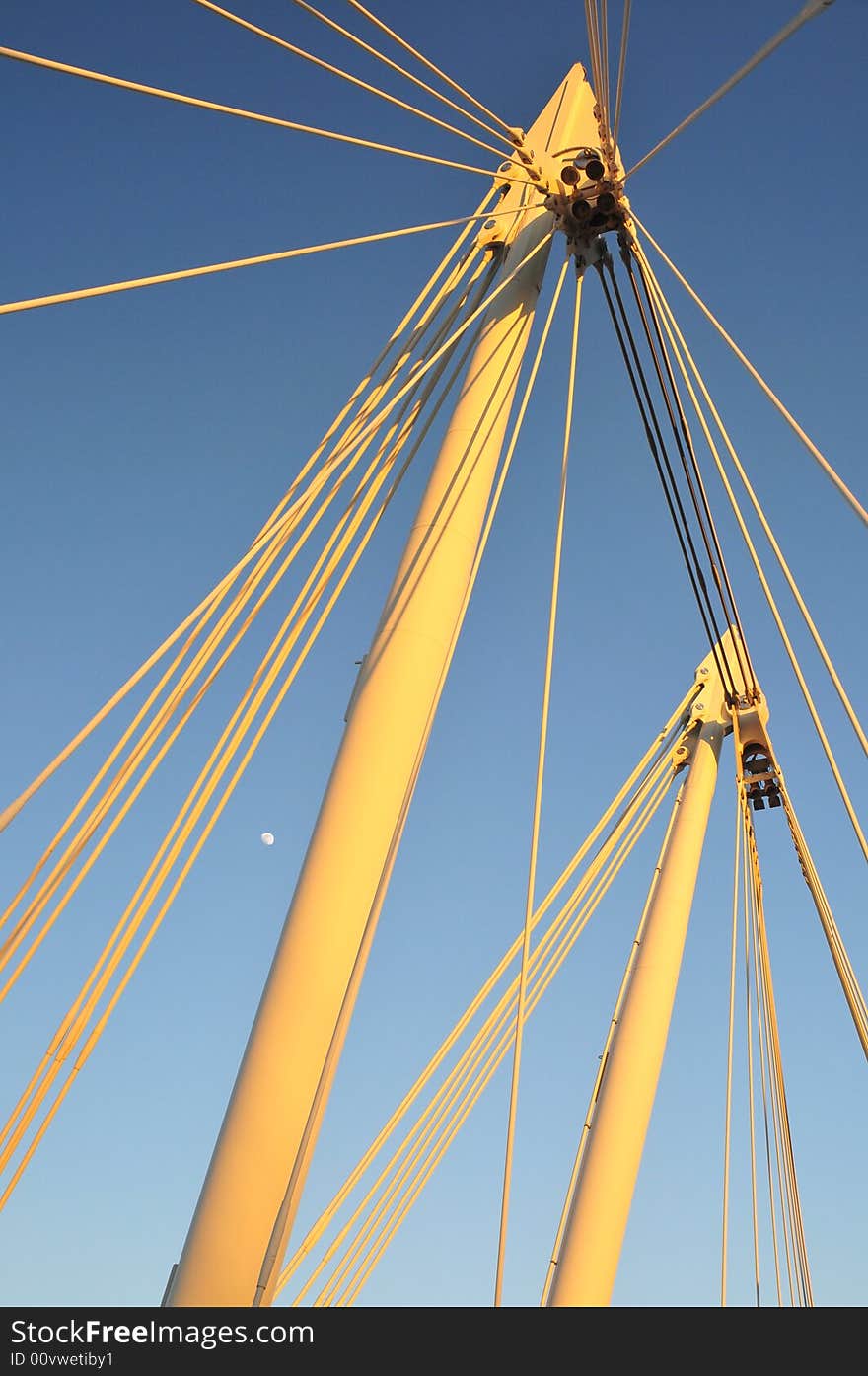 Structure detail of Golden Jubilee footbridges on Thames Embankment with moon in background. Good example of modern steel bridge architecture. Structure detail of Golden Jubilee footbridges on Thames Embankment with moon in background. Good example of modern steel bridge architecture.