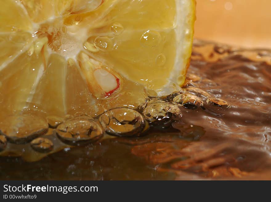 Fresh lemon in really cold water. Fresh lemon in really cold water