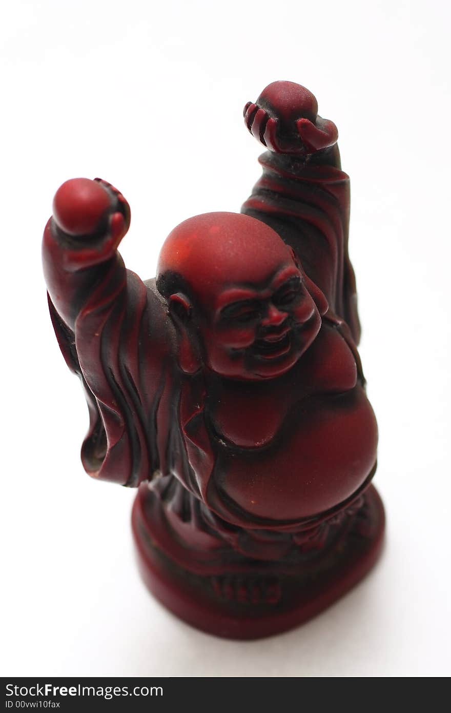 Isolated shot of red buddha statue on white background