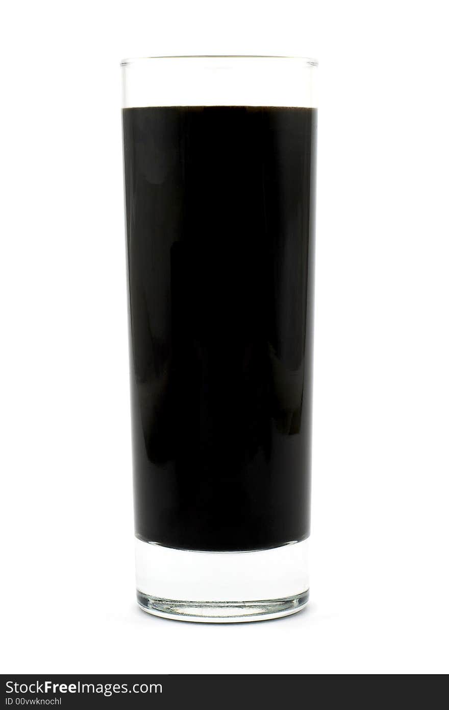 Isolated photo of glass of black liquid