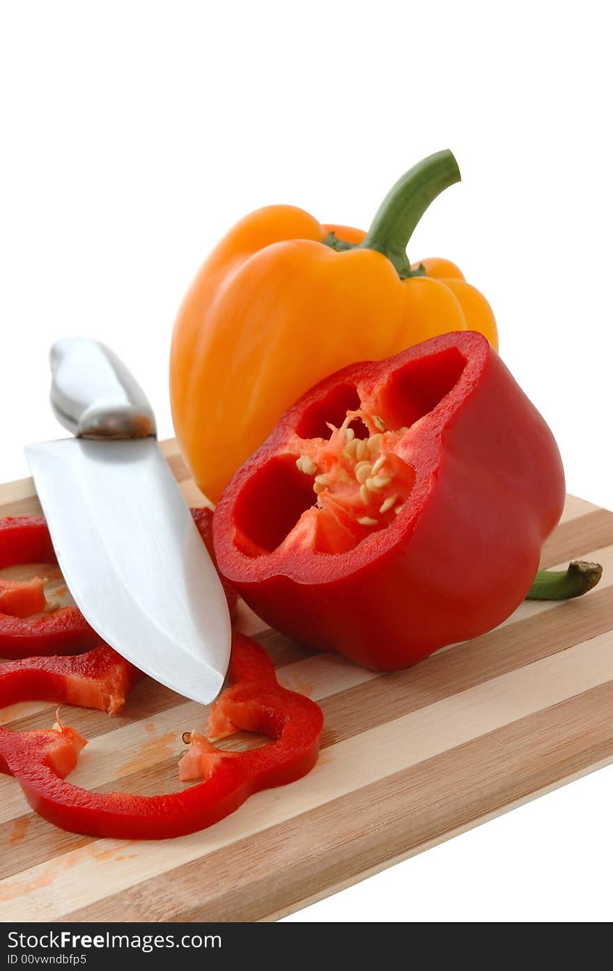 Red and yellow paprika on bamboo cutting board. Red and yellow paprika on bamboo cutting board