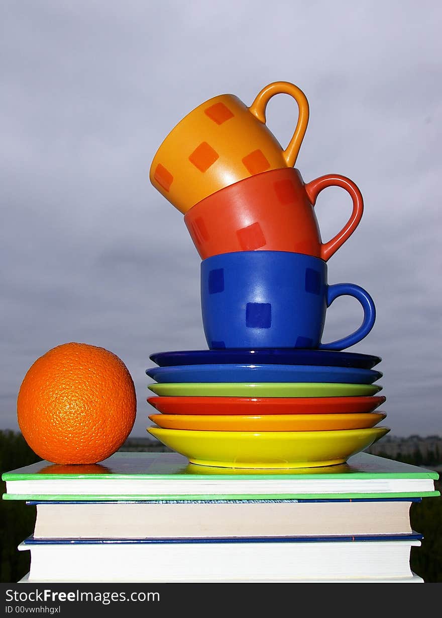 Cups, Books And Orange