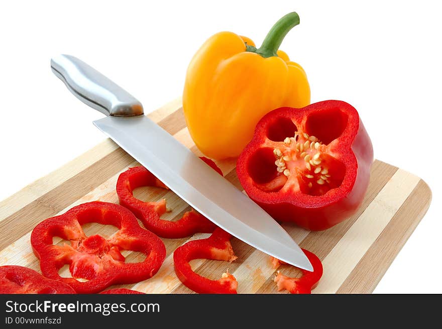 Red and yellow paprika on bamboo cutting board. Red and yellow paprika on bamboo cutting board