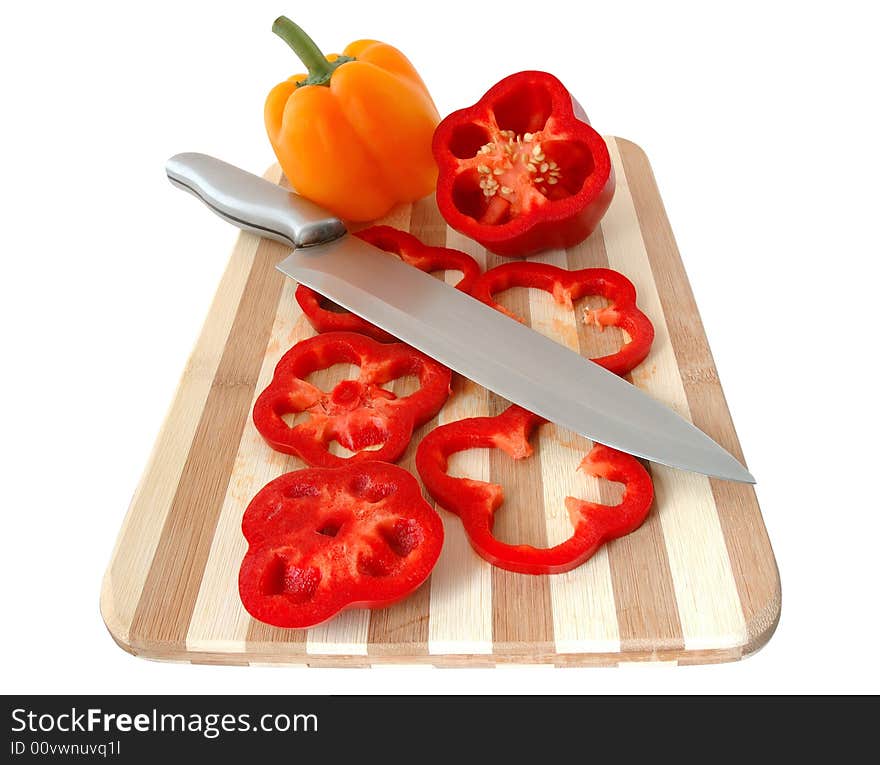 Red and yellow paprika on bamboo cutting board. Red and yellow paprika on bamboo cutting board