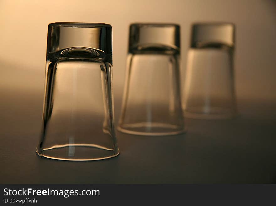 Three empty alcohol glasses, distance blur. Three empty alcohol glasses, distance blur