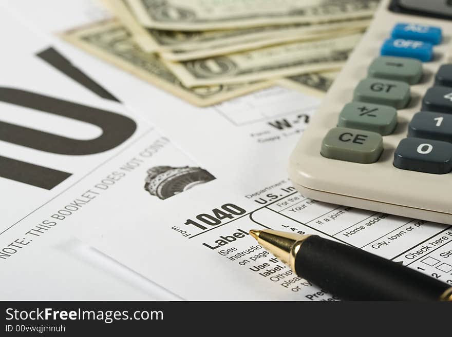 United States Tax Form, calculator, dollars and pen