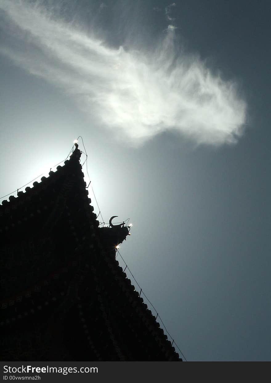 After a summer rain, a cloud floats over the ancient building of Qianmen town of Beijing, China. After a summer rain, a cloud floats over the ancient building of Qianmen town of Beijing, China.